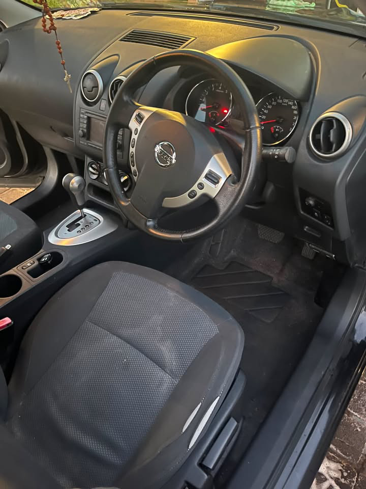 Cleaned car interior showing vacuumed seats, wiped dashboard and clean floor mats